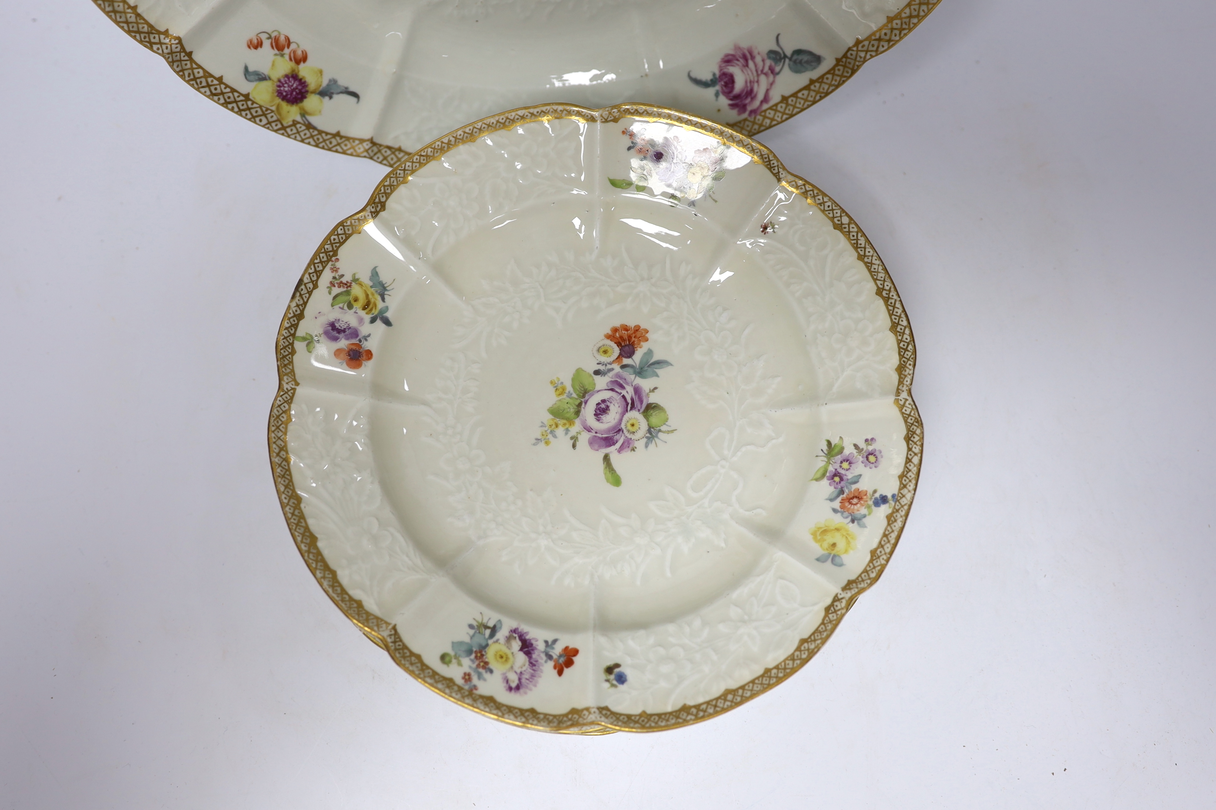 A large Meissen moulded porcelain dish and five matching plates, c.1760-70, each painted with Deutsche Blumen, dish 32cm diameter